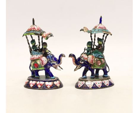 A pair of Indian gilt white metal and polychrome enamel elephants with howdahs, height 77mm.