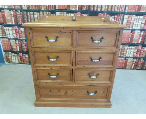 A pine chest of drawers with blue and white ceramic handles (W110 x D50 x H114cm)