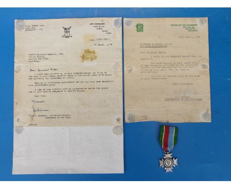 A Rhodesian Silver Cross Medal awarded to 644553 A/Sgt S.Mpofu of the Selous Scouts, with letter from J.S.V Hickman, Commande