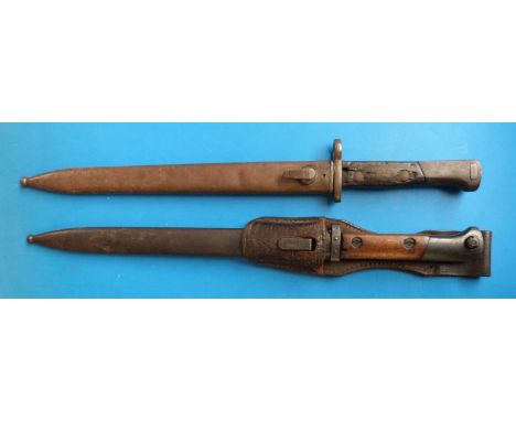 A Czechoslovakian bayonet marked E27 and CSZ, in scabbard, the frog marked Berlin 1937 together with another similar style ba