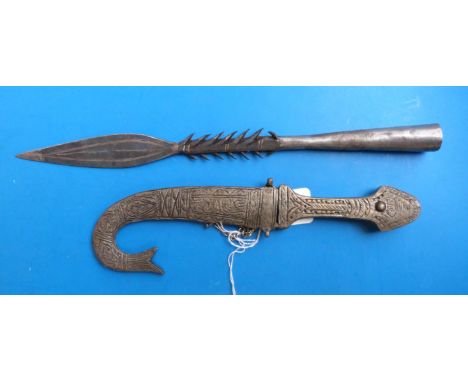 A small Indian kukri knife with fish tail style scabbard, together with an African spear head with harpoon barbs