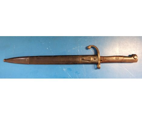 A possibly French late 19th century / WWI era bayonet in scabbard.  16561 to hilt, 30cm blade 