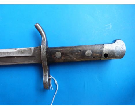 A c1927 Finnish bayonet with round quillon-like crossguard, no scabbard, 30.5cm blade by Fiskars, No 38712 to handle