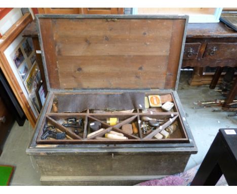 A large and extensive collection of woodworking tools including planes and other tools housed in a vintage pine multi layered