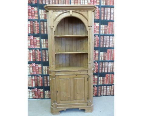 A pine corner display cabinet with three-shelf top and cupboards under (height 203.5cm)