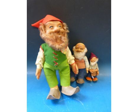 Three Steiff gnomes, one dressed in green felt clothing with red hat and original labels (32cm tall), the other two dressed i