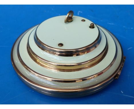 A green enamel and gilt musical compact plays 'La Vie en Rose'