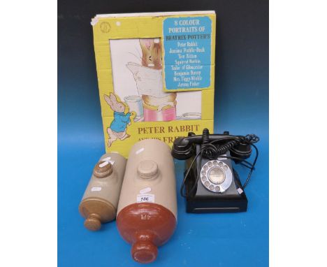 Two ceramic hot water bottles, vintage telephone and Beatrix Potter poster 
