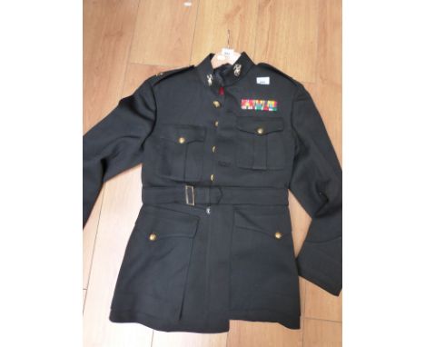 An American military tunic and trousers with collar insignia and medal bars