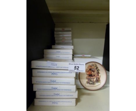Fifty one miniature Goebel Hummel plates with various dates (boxed)