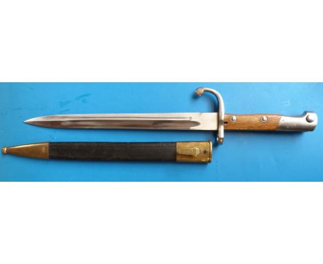 A c1900 German bayonet by W K and CIE Solingen, 964 to hilt, wood grips, 30cm blade in scabbard