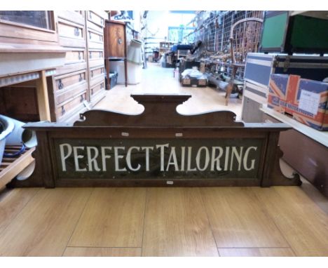A vintage 'Perfect Tailoring' mahogany and illuminated glass shop sign (width 120cm)