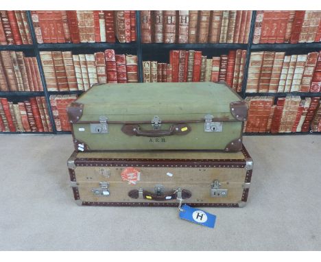 A vintage travelling trunk with GWR and Cunard Mauretania labels together with another vintage suitcase