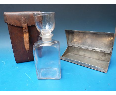 A 19thC / 20thC leather-cased metal sandwich box and metamorphic decanter / glass. Probably military / hunting