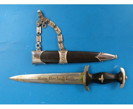 A Nazi German SS dress dagger with black handle and inset SS logo to top, the blade with motto 'Meine Ehre heipt Treue', the 