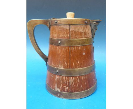 A late 19thC coopered brass bound jug with ceramic liner 
