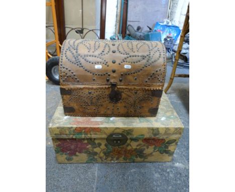 A domed leather studded trunk with iron fittings together with another box, with painted floral decoration (domed trunk H30 x