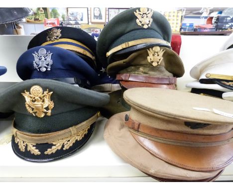 A quantity of US Military Corps and other headgear, mainly Army, together with a panel stitched American flag by Defiance 