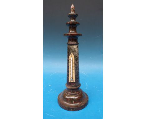 A serpentine lighthouse thermometer with red flecks to body