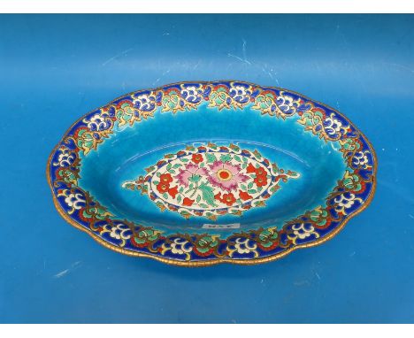 An oval Longwy bowl with enamel decoration 