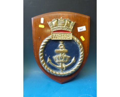 A WRNS brass tampion Naval crest on wooden plaque (height 37cm)