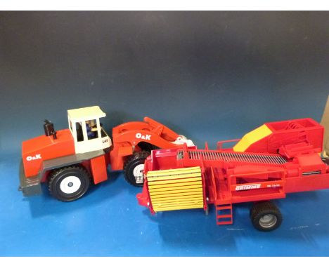 A collection of large scale farm and construction vehicles and sets, two in original boxes 