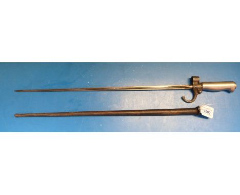 A c1886 French stick bayonet with white metal handle, 50633 stamped to guillon, 52cm quadrangular blade in metal scabbard