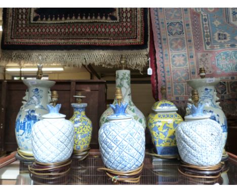 A collection of eight decorative Chinese ceramic lamps 