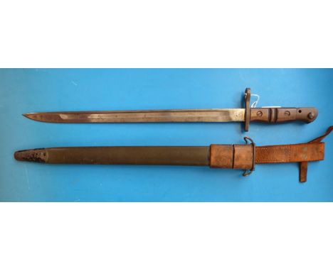 A 1917 Remington bayonet with leather scabbard