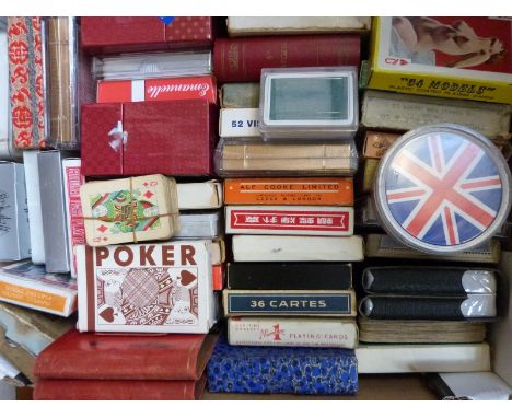 Approximately 100 packets of playing cards to include Cunard QE2, Emmanuelle transformation cards, Waddingtons etc