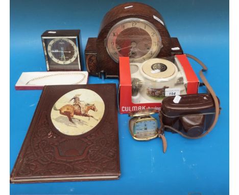 An oak cased three train mantel clock, retro alarm clock, camera, faux pearls etc