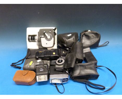 A collection of vintage cameras and equipment including a Keystone cine camera, Halina, Panasonic, Kodak etc