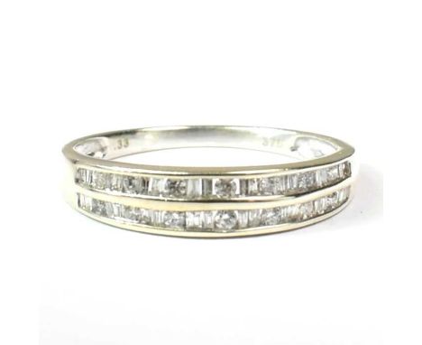 A hallmarked 9ct gold and diamond two-row half eternity ring. Estimated diamond weight 0.33cts. Weight 2.2g. Size R. All weig