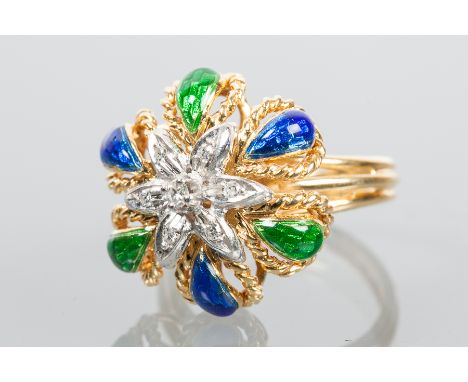 UNUSUAL DIAMOND AND ENAMEL DRESS RING
with a central brilliant cut diamond surrounded by further diamonds, and with enamelled