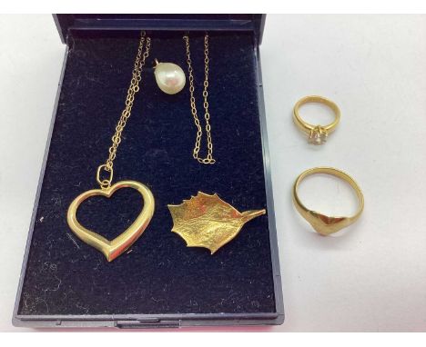 A Dainty Elongated Link Chain, stamped "375", suspending an openwork heartshape pendant, together with a heartshape signet ri