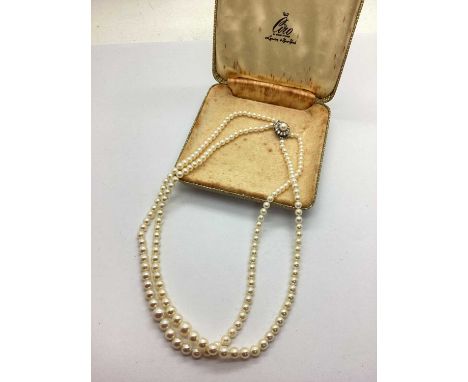 Ciro; A Multi-Strand Graduated Cultured Pearl Bead Necklace, to fancy clasp of flowerhead design with inlaid pearl bead and c