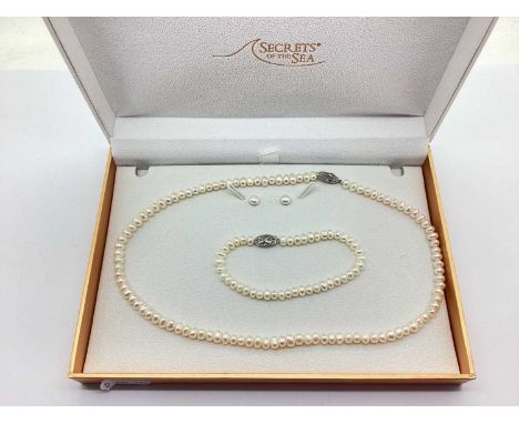 A Modern Hallmarked Silver Clasped Freshwater Pearl Bead Necklace, the fancy clasp with illusion set single stone diamond, su