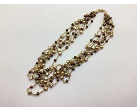 A Freshwater Pearl Bead Multistrand Necklace, the brown and champagne coloured pearls to rope connections and fancy clasp sta