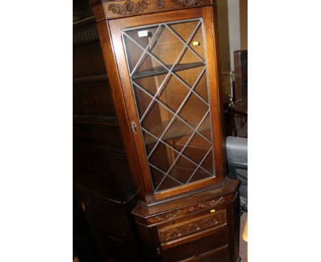 A GLAZED OAK CORNER CUPBOARD TOGETHER WITH A STANDARD LAMP 