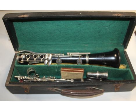 A CASED BOOSEY AND HAWKES CLARINET TOGETHER WITH A RECORDER