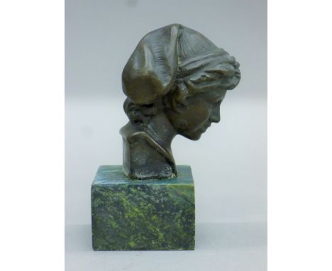 A small bronze bust. 13 cm high.