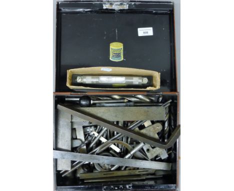 A tin of engineering tools. The tin 29.5 cm wide.