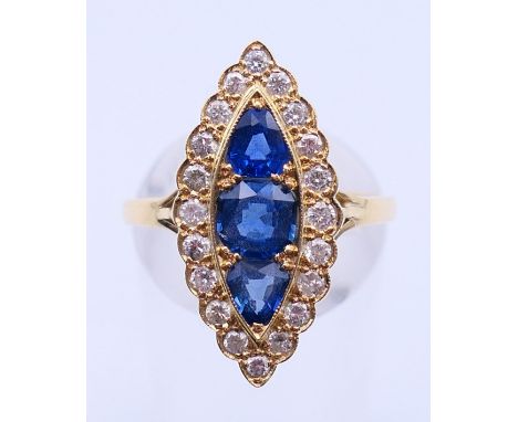 An unmarked gold, diamond and sapphire ring. Ring size P. 