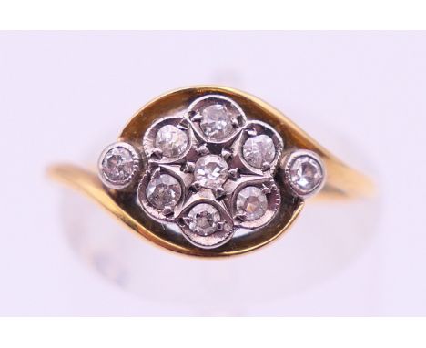 An 18 ct gold and diamond ring. Ring size L. 