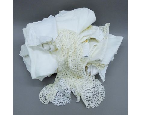 A quantity of linen, to include a large panelled embroidered and crocheted tablecloth, napkins, doilies, tablecloths, handker