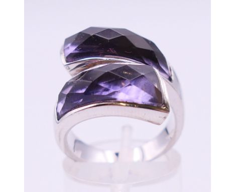 A silver ring set with amethyst and coloured stones. Ring size N. 