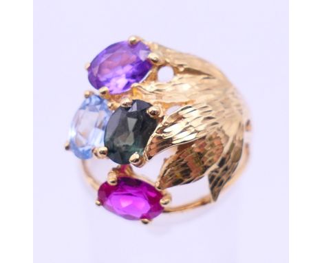 A 18 ct gold multi-gem stone ring. Ring size M/N. 