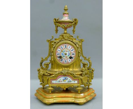 A 19th century porcelain-mounted mantle clock. 34.5 cm high.