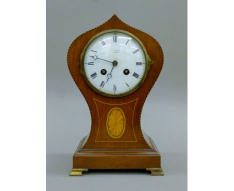 An Edwardian inlaid mahogany mantle clock. 27.5 cm high.