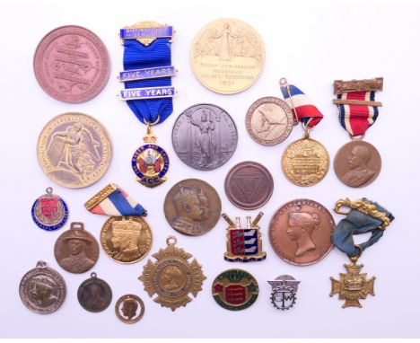 A collection of various medallions, badges and commemorative medallions to include Baden Powell, 1887 Jubilee, etc.